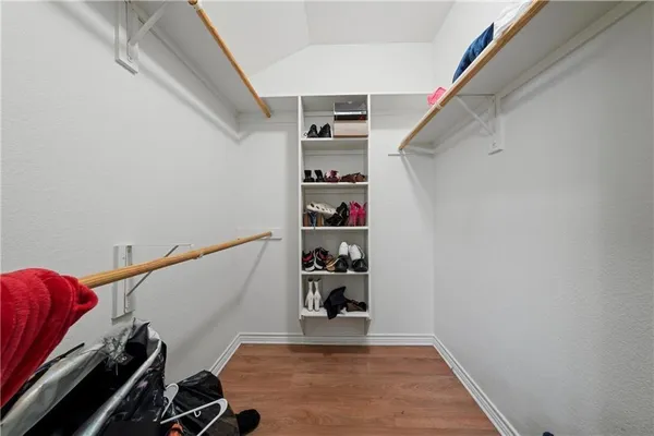 a view of a hallway with closet