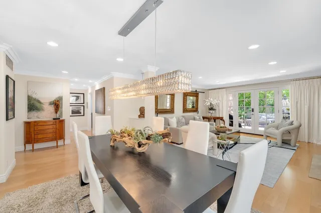 a dining room with furniture and wooden floor