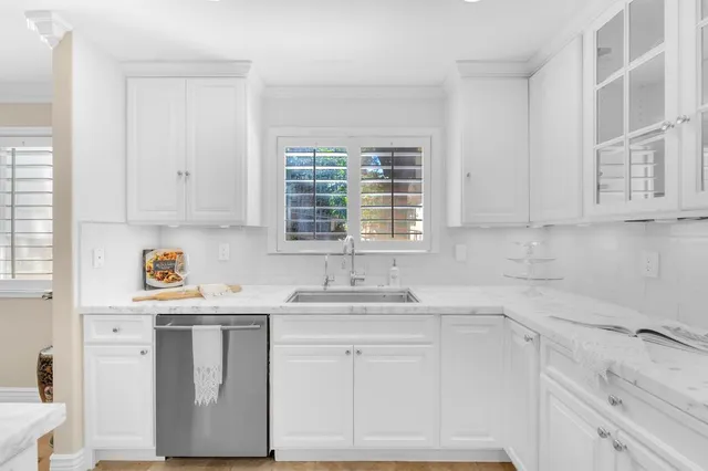 a kitchen with stainless steel appliances granite countertop a stove and a sink