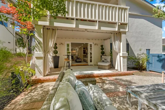 a view of living room filled with furniture and a rug