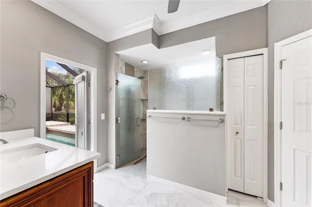 a bathroom with a sink a mirror and a shower