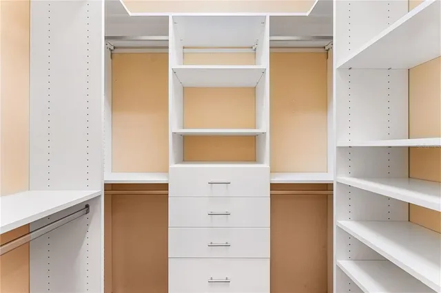 a view of an empty walk in closet