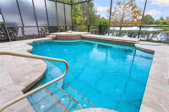 a swimming pool with outdoor seating and yard