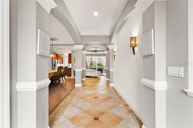 a view of a hallway with couch and a potted plant