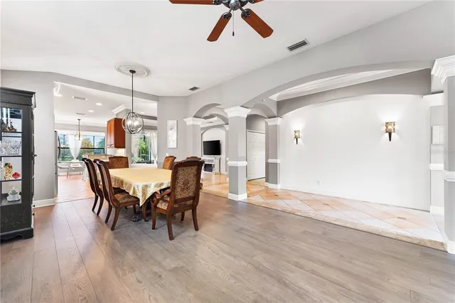 a view of a dining room with furniture and wooden floor