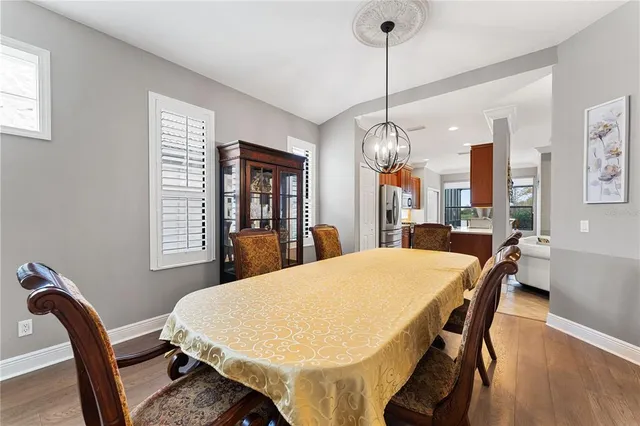 a dining room with furniture and window
