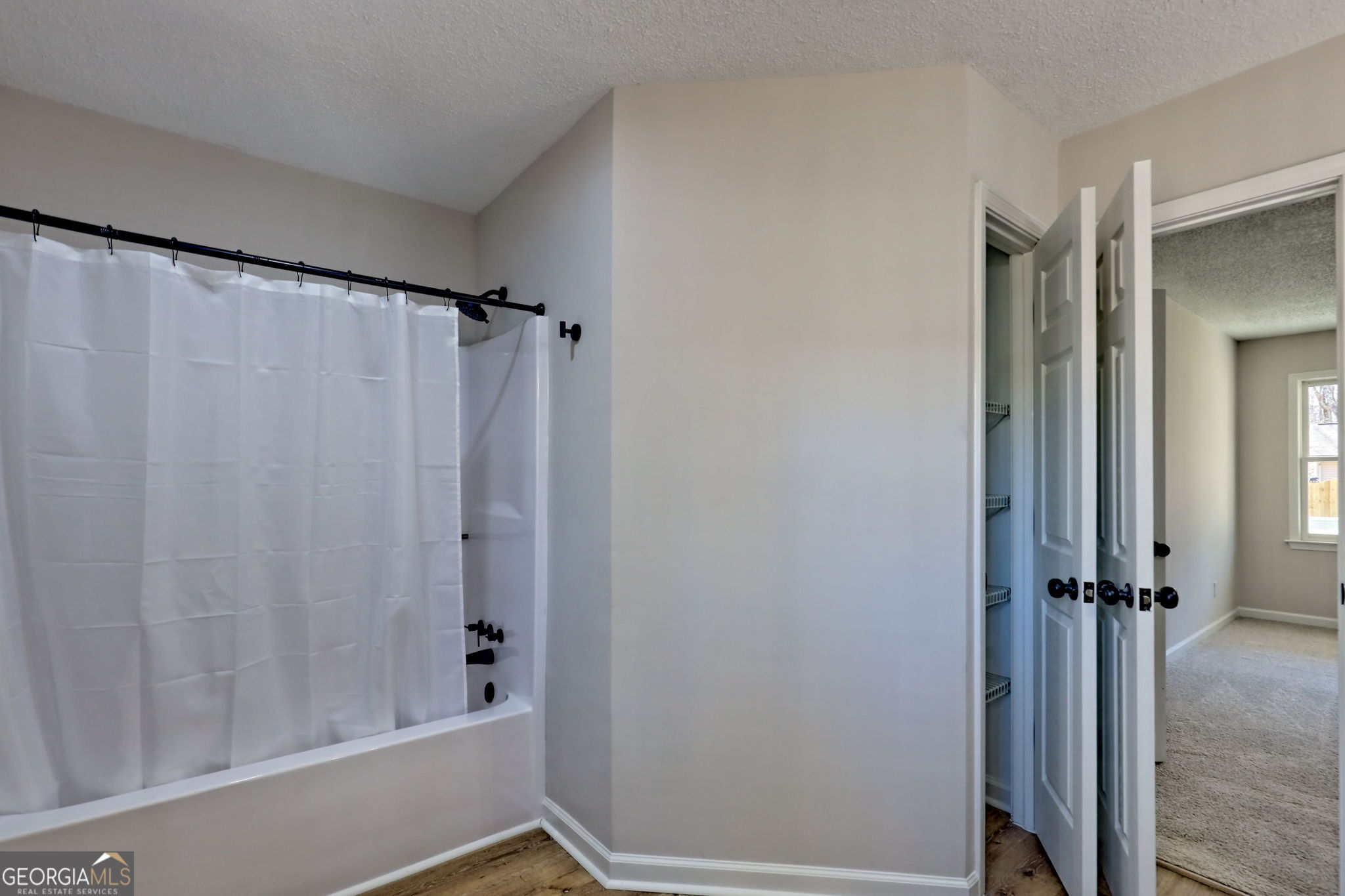 233 Piney Ridge Road Jasper, GA 30143 - Photo 14 of 38 a bathroom with a shower and a tub