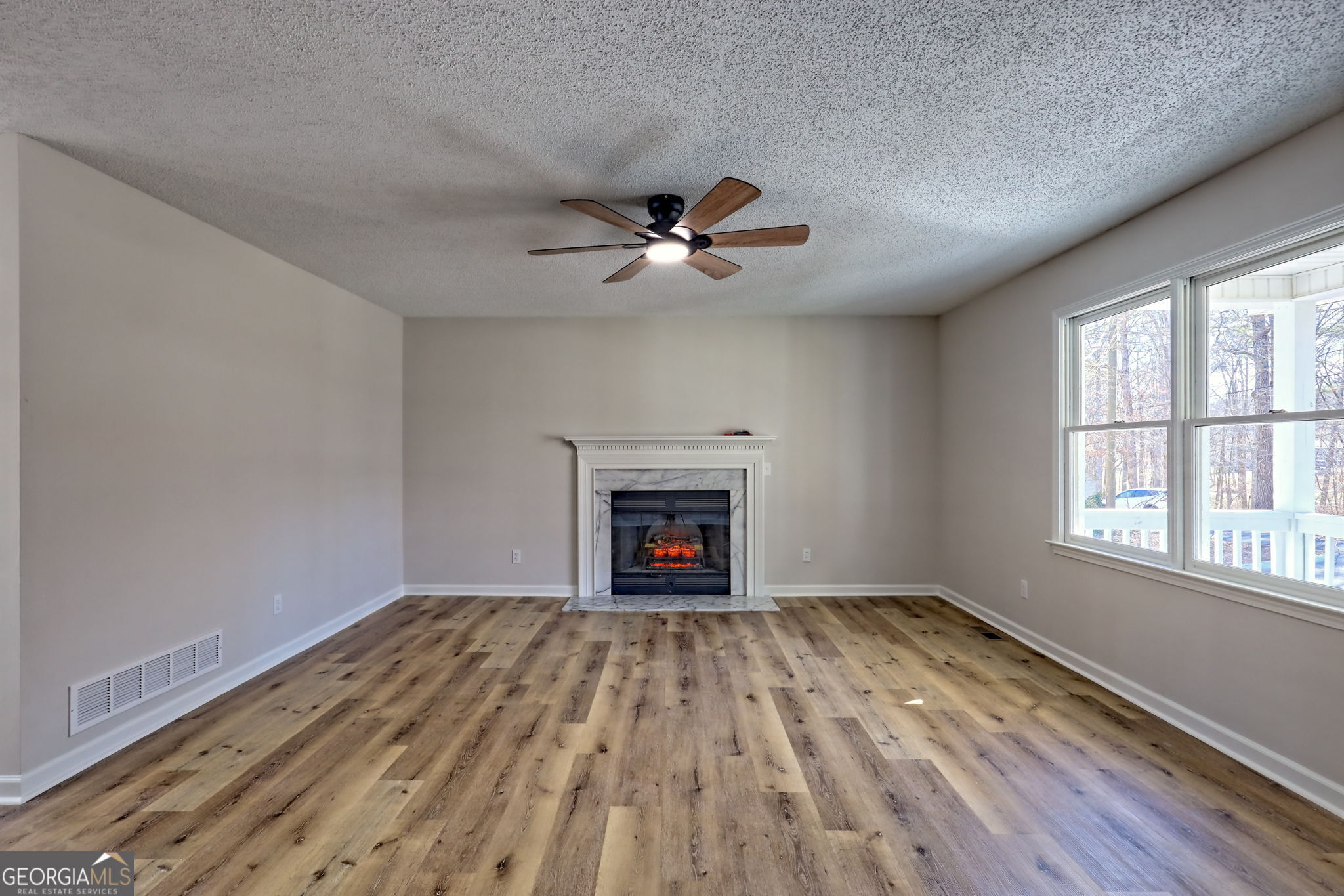233 Piney Ridge Road Jasper, GA 30143 - Photo 5 of 38 wooden floor in an empty room with a window