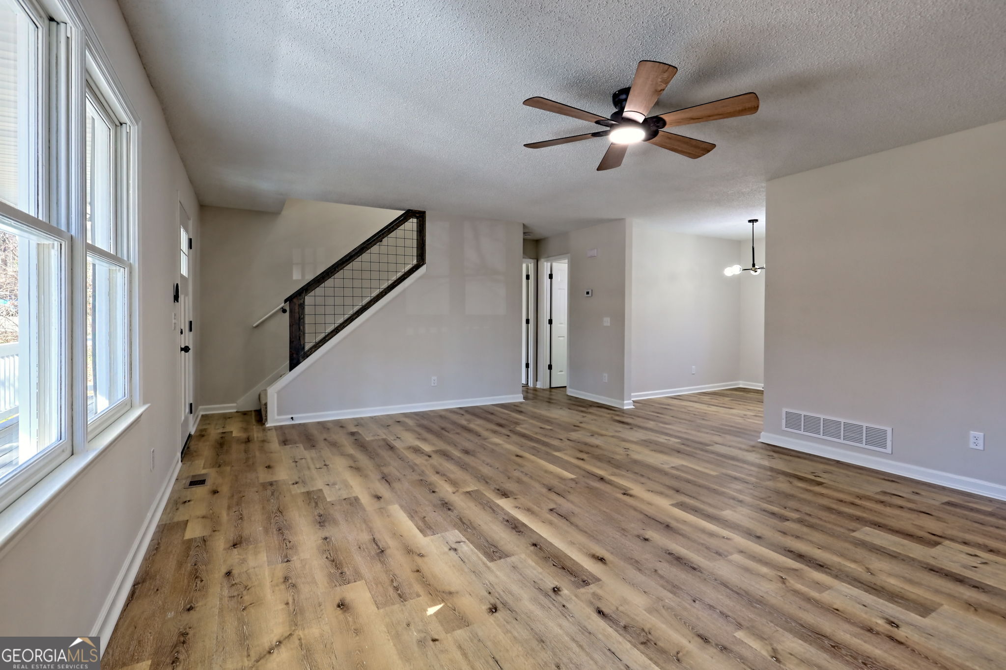 233 Piney Ridge Road Jasper, GA 30143 - Photo 7 of 38 wooden floor in an empty room with a window