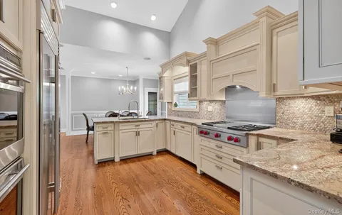 a kitchen with a stove a sink and a refrigerator