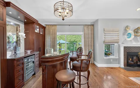 a living room with furniture a fireplace and a table