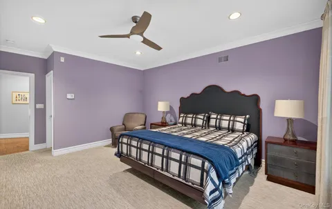 a bedroom with a bed and a lamp