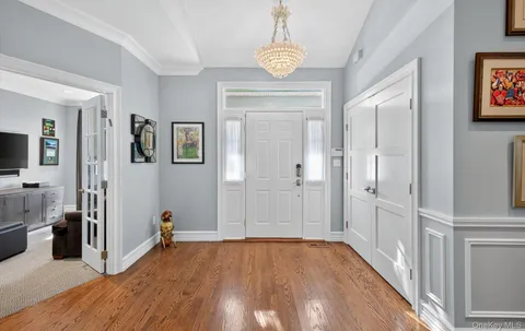 a view of a hallway view with wooden floor and workspace