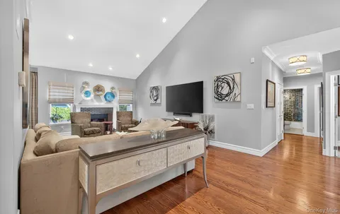 a room with furniture and a flat screen tv