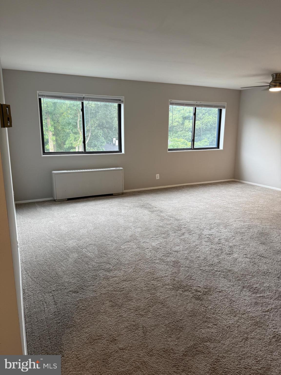 8601 Manchester Road, Unit 513 Silver Spring, MD 20901 - Photo 8 of 22 an empty room with windows
