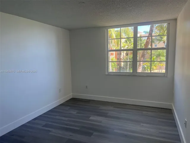wooden floor and window in an empty room