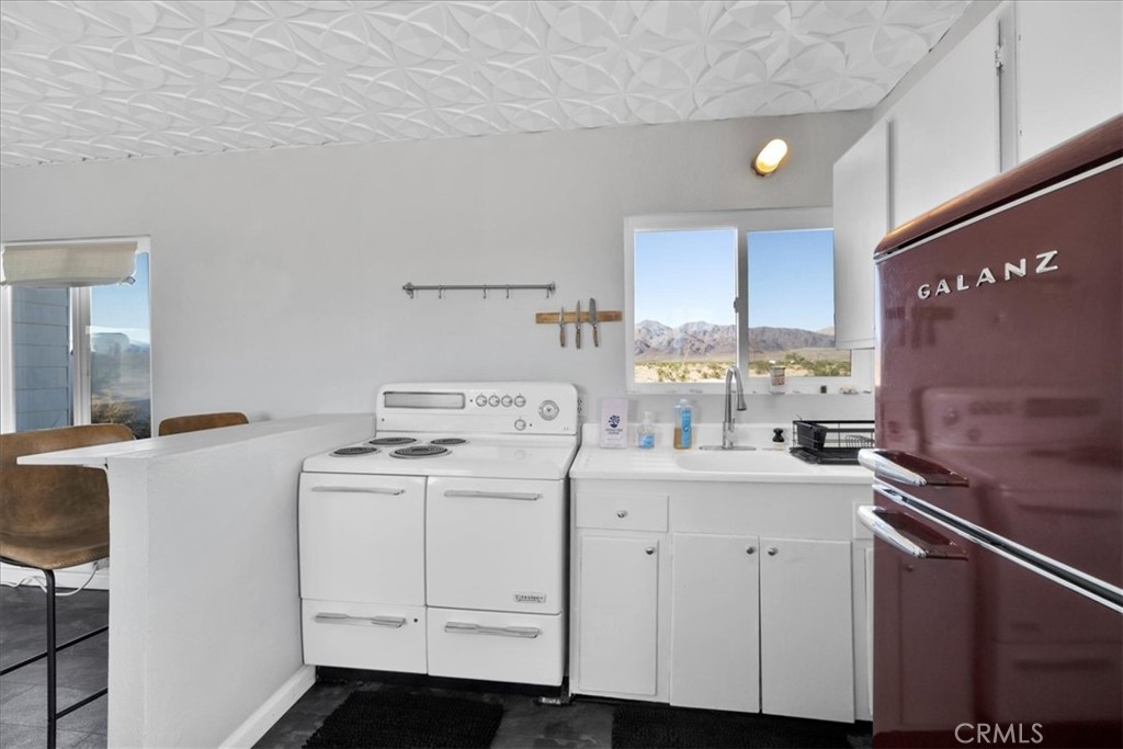 84753 Eddie Albert Road Twentynine Palms, CA 92277 - Photo 11 of 52 a room with storage and utility