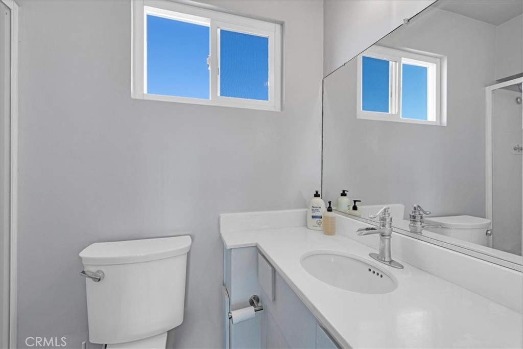 84753 Eddie Albert Road Twentynine Palms, CA 92277 - Photo 21 of 52 a bathroom with a sink a toilet and a mirror