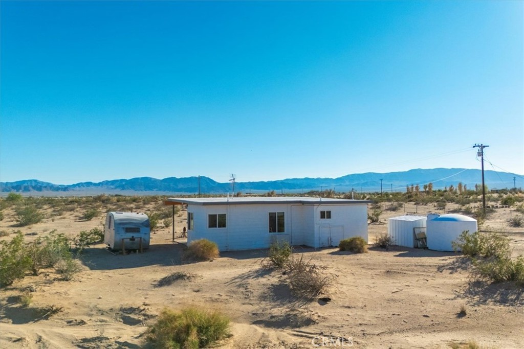 84753 Eddie Albert Road Twentynine Palms, CA 92277 - Photo 25 of 52 a view of a house with a outdoor space