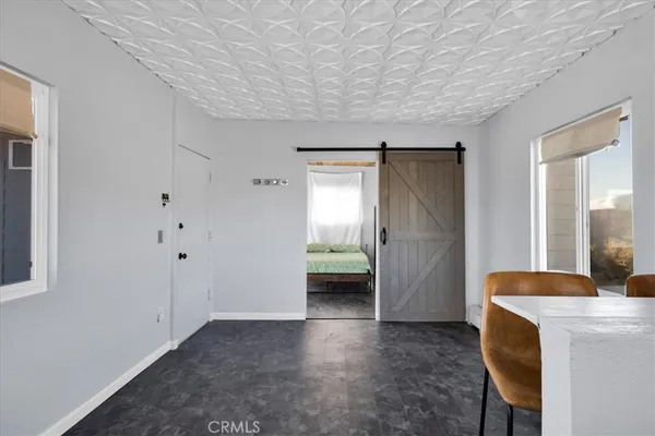 a view of a window and a table in a living room