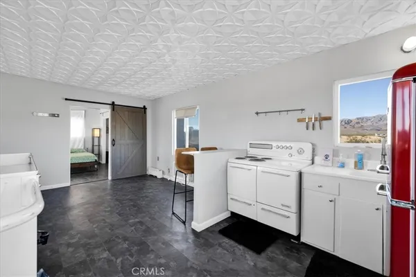 a view of a glass door and a window