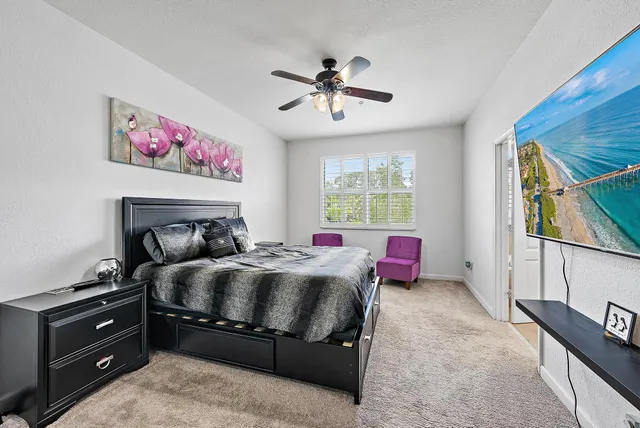 a bedroom with a bed and a dresser