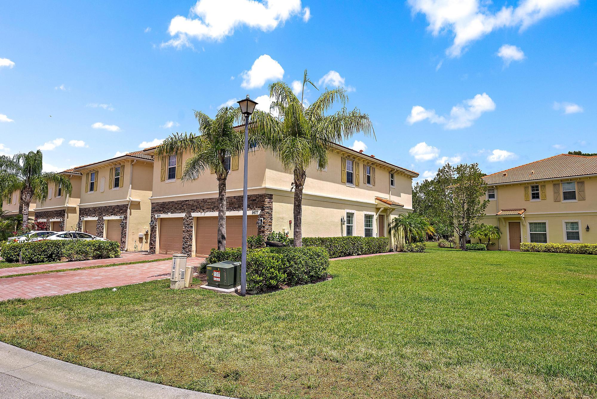 9677 Southwest Purple Martin Way Stuart, FL 34997 - Photo 2 of 29 a house view with a garden space