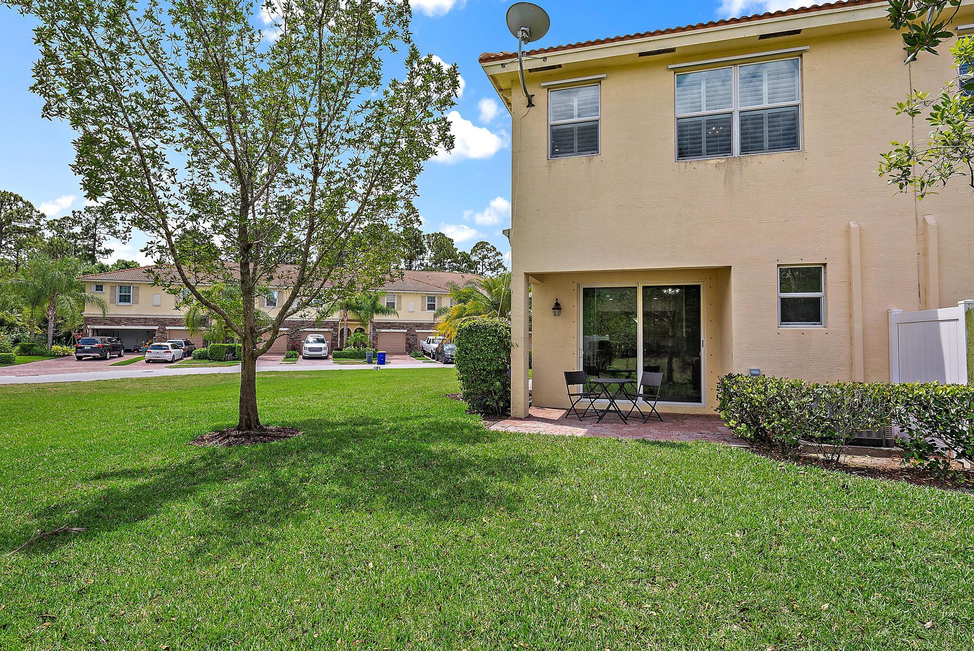 9677 Southwest Purple Martin Way Stuart, FL 34997 - Photo 21 of 29 a house view with a garden space