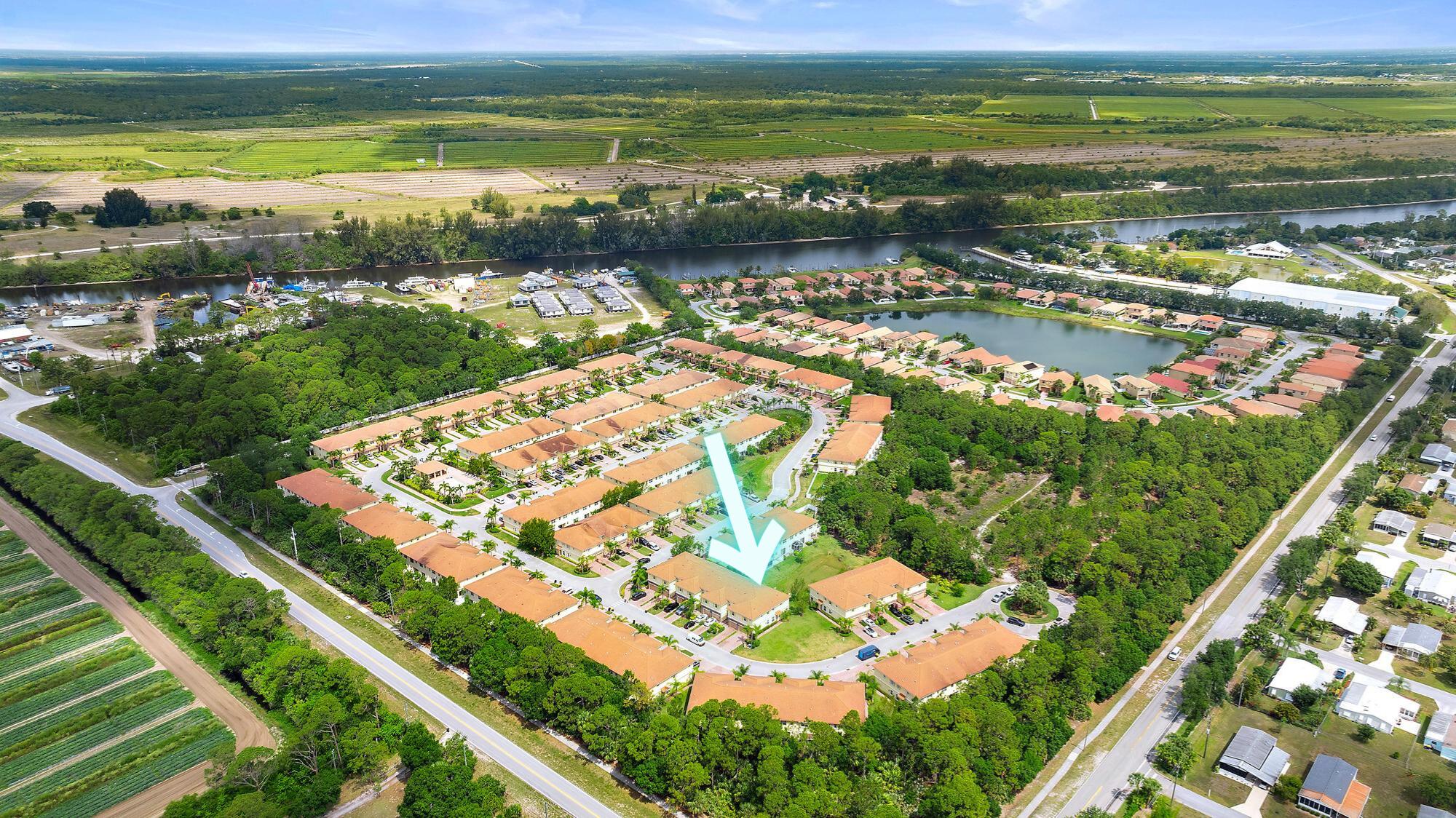 9677 Southwest Purple Martin Way Stuart, FL 34997 - Photo 23 of 29 a view of a city with an ocean