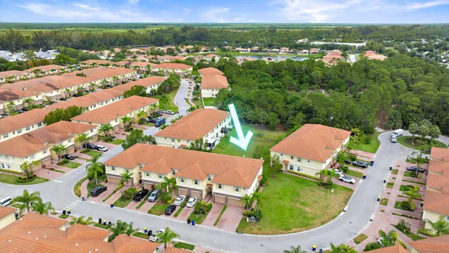 an aerial view of residential houses and outdoor space