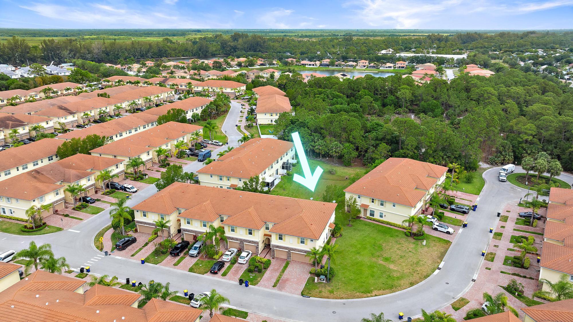 9677 Southwest Purple Martin Way Stuart, FL 34997 - Photo 29 of 29 an aerial view of residential houses and outdoor space