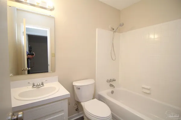 a bathroom with a toilet a sink and a bathtub
