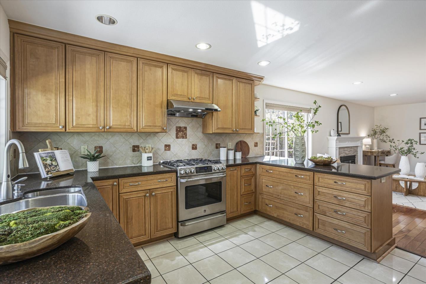 6367 Prospect Road San Jose, CA 95129 - Photo 11 of 33 a kitchen with a sink stove and cabinets