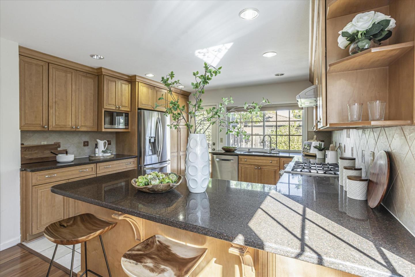 6367 Prospect Road San Jose, CA 95129 - Photo 12 of 33 a living room with stainless steel appliances furniture a rug and a kitchen view