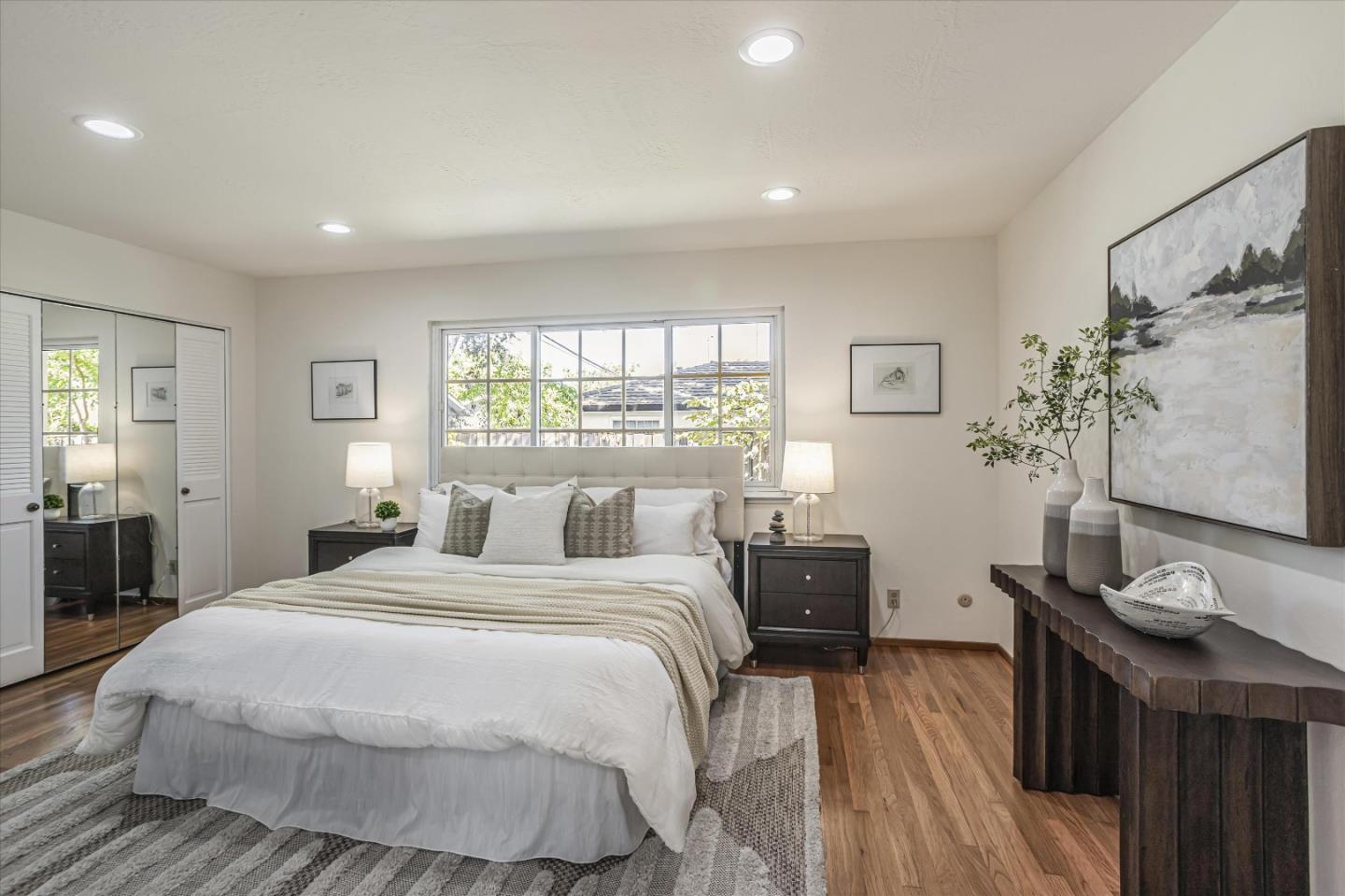 6367 Prospect Road San Jose, CA 95129 - Photo 17 of 33 a bedroom with a bed and wooden floor