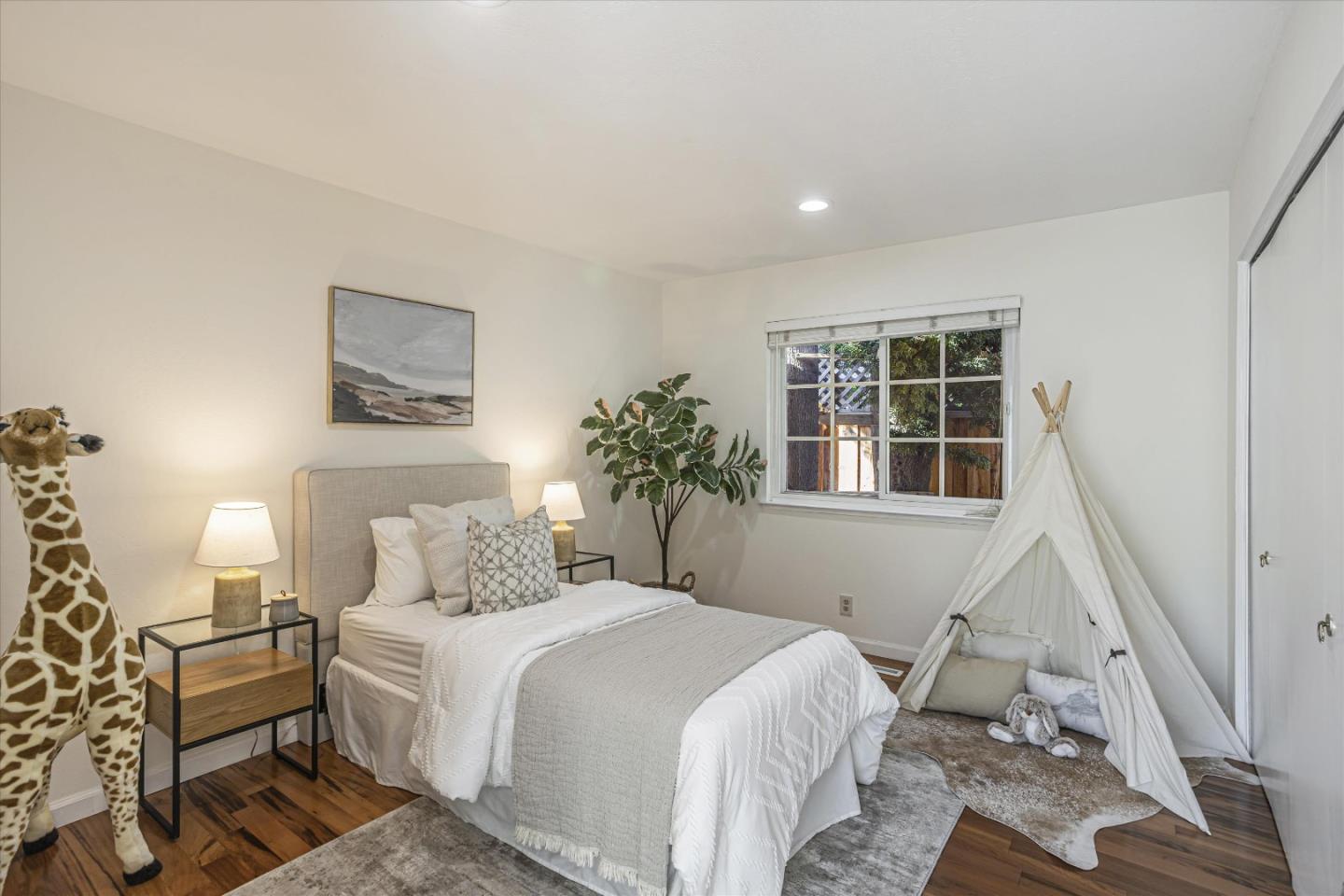 6367 Prospect Road San Jose, CA 95129 - Photo 19 of 33 a bedroom with a bed and a window