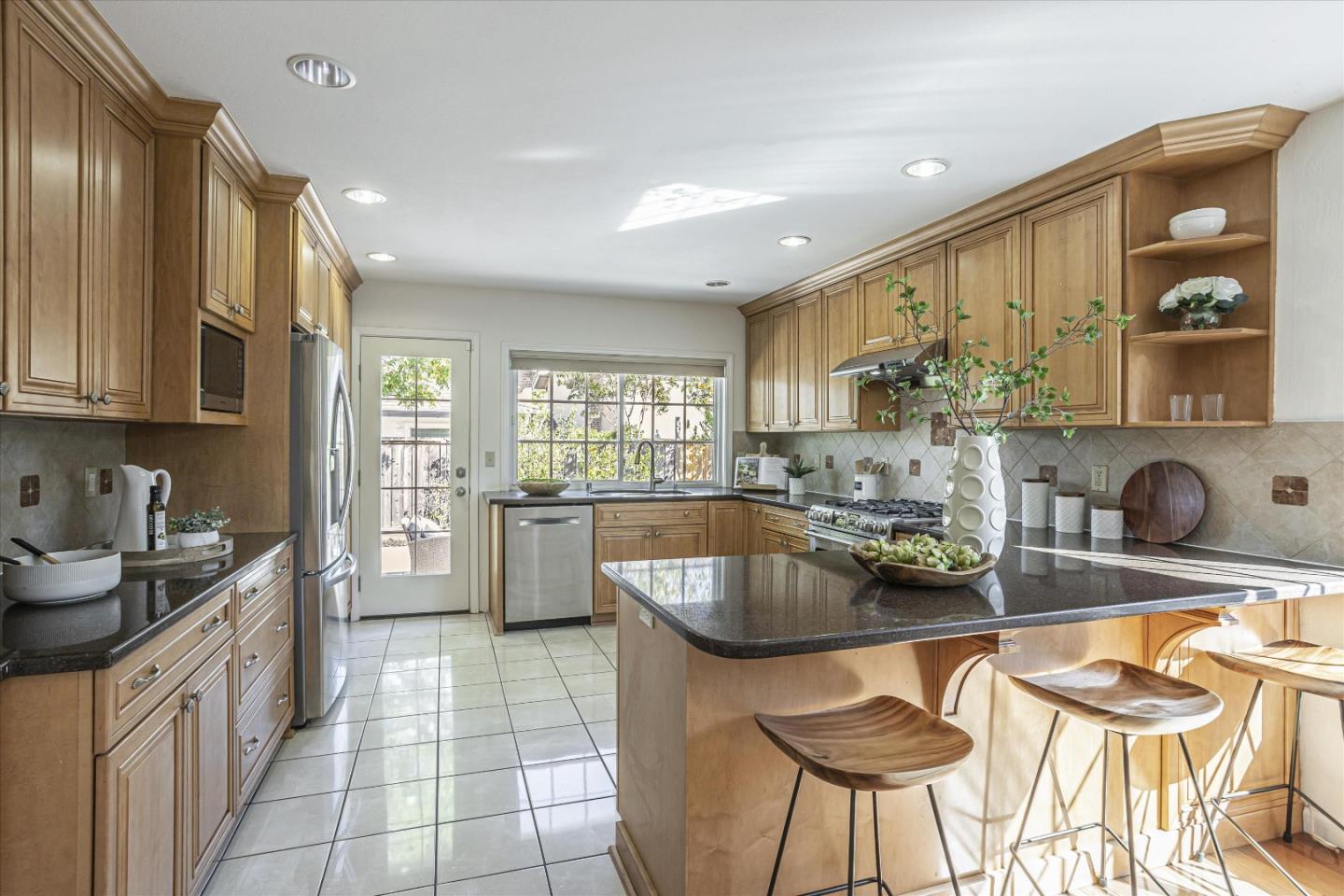 6367 Prospect Road San Jose, CA 95129 - Photo 10 of 33 a kitchen with a sink and cabinets