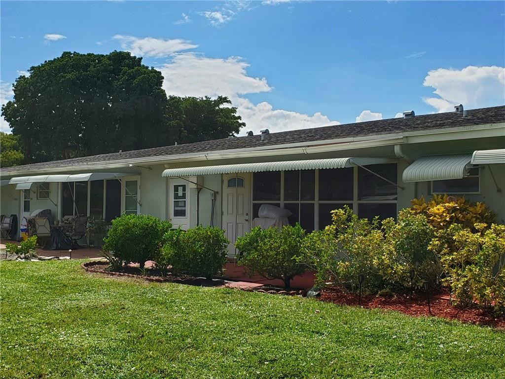 565 High Point Drive, Unit B Delray Beach, FL 33445 - Photo 17 of 33 Back w/Patio