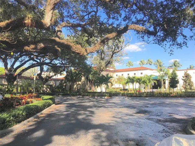 a night view of building with trees