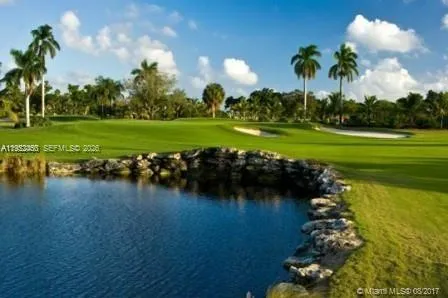 a view of a lake with a big yard