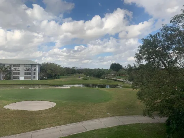 a view of a water with a big yard