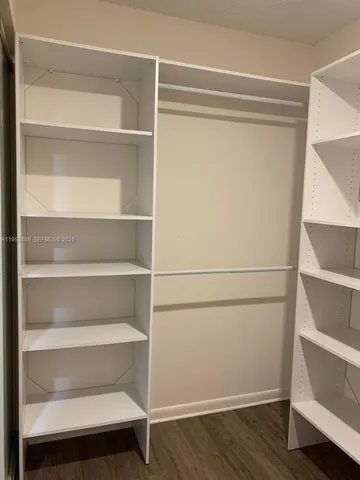 a view of an empty walk in closet