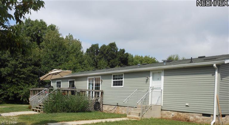 2756 Saxe Road Mogadore, OH 44260 - Photo 2 of 22 Large deck with privacy and sweeping views