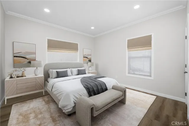 a spacious bedroom with a bed and a couch