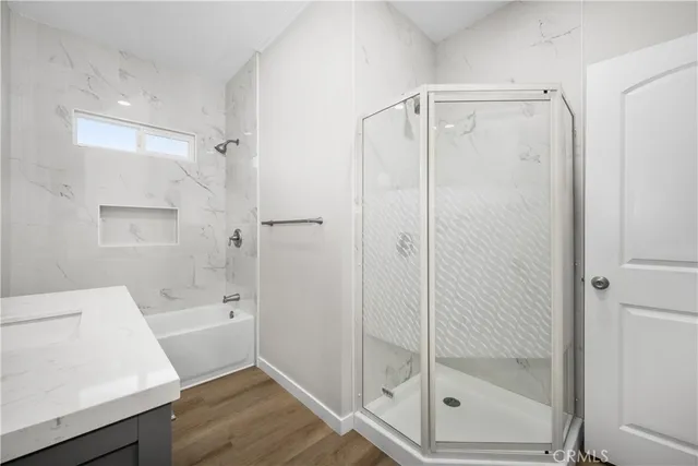 a bathroom with a shower and a sink