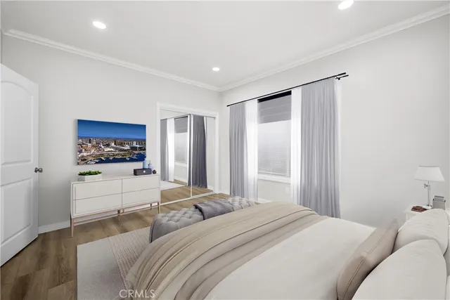 a bedroom with a large bed and a window