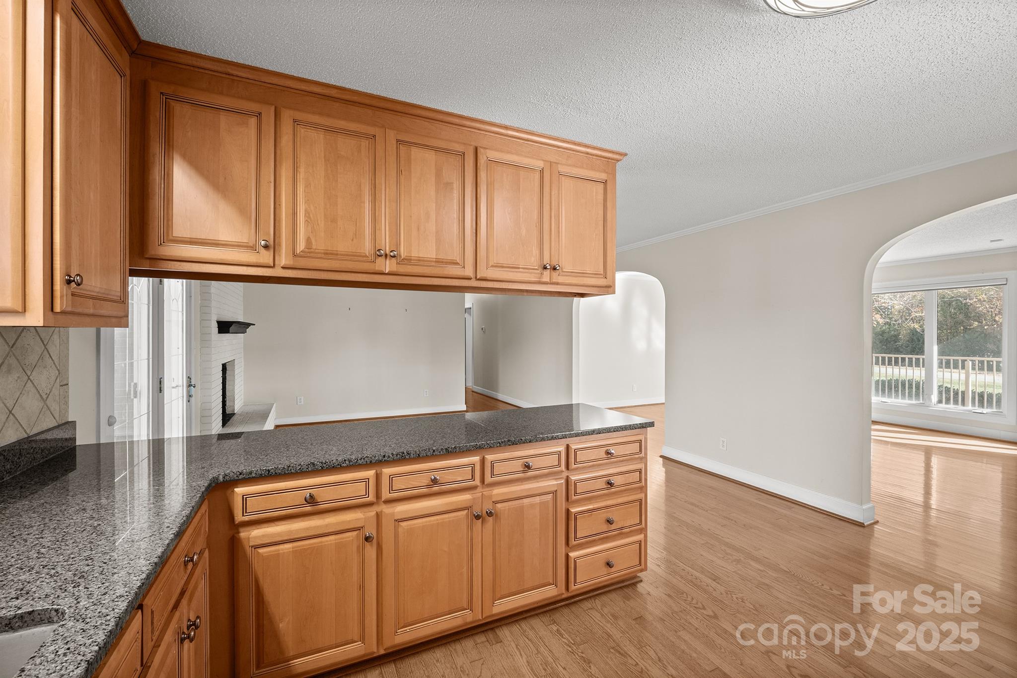 484 Stutts Road Mooresville, NC 28117 - Photo 13 of 28 a kitchen with granite countertop stainless steel appliances a sink and cabinets