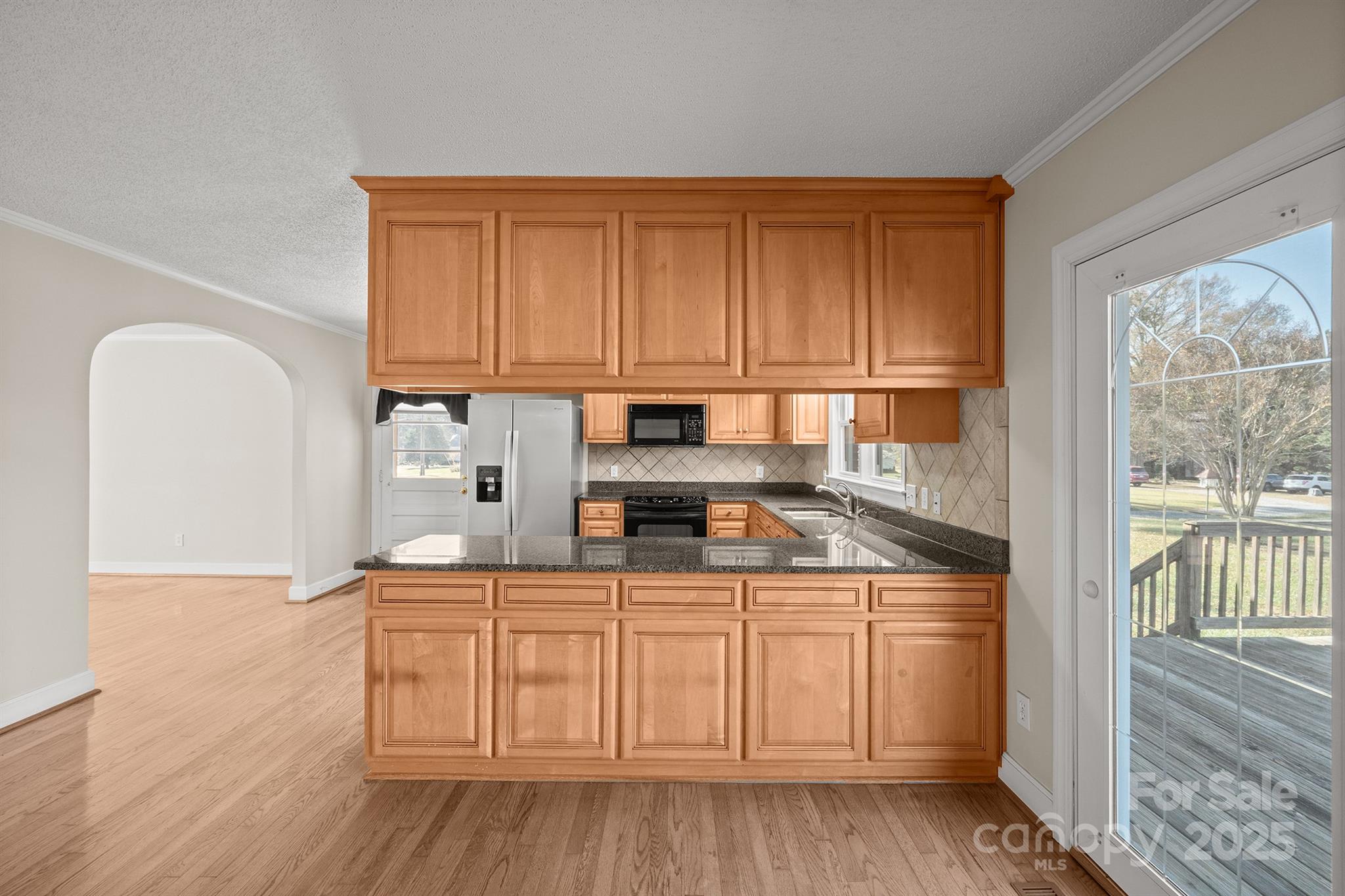484 Stutts Road Mooresville, NC 28117 - Photo 14 of 28 a kitchen with white cabinets and sink