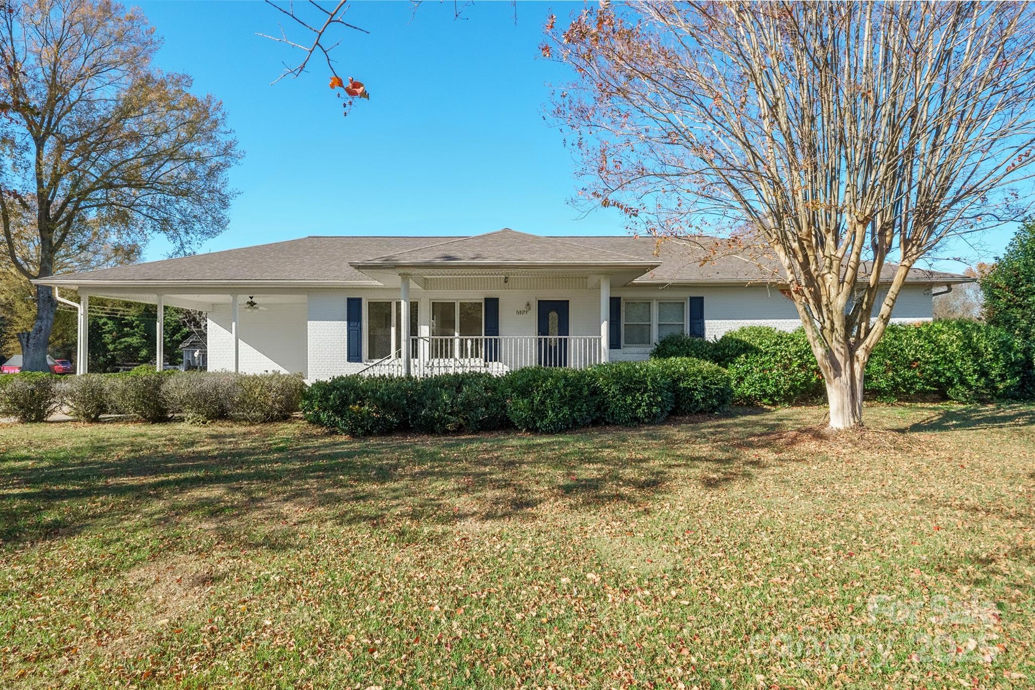 484 Stutts Road Mooresville, NC 28117 - Photo 2 of 28 a front view of a house with a garden