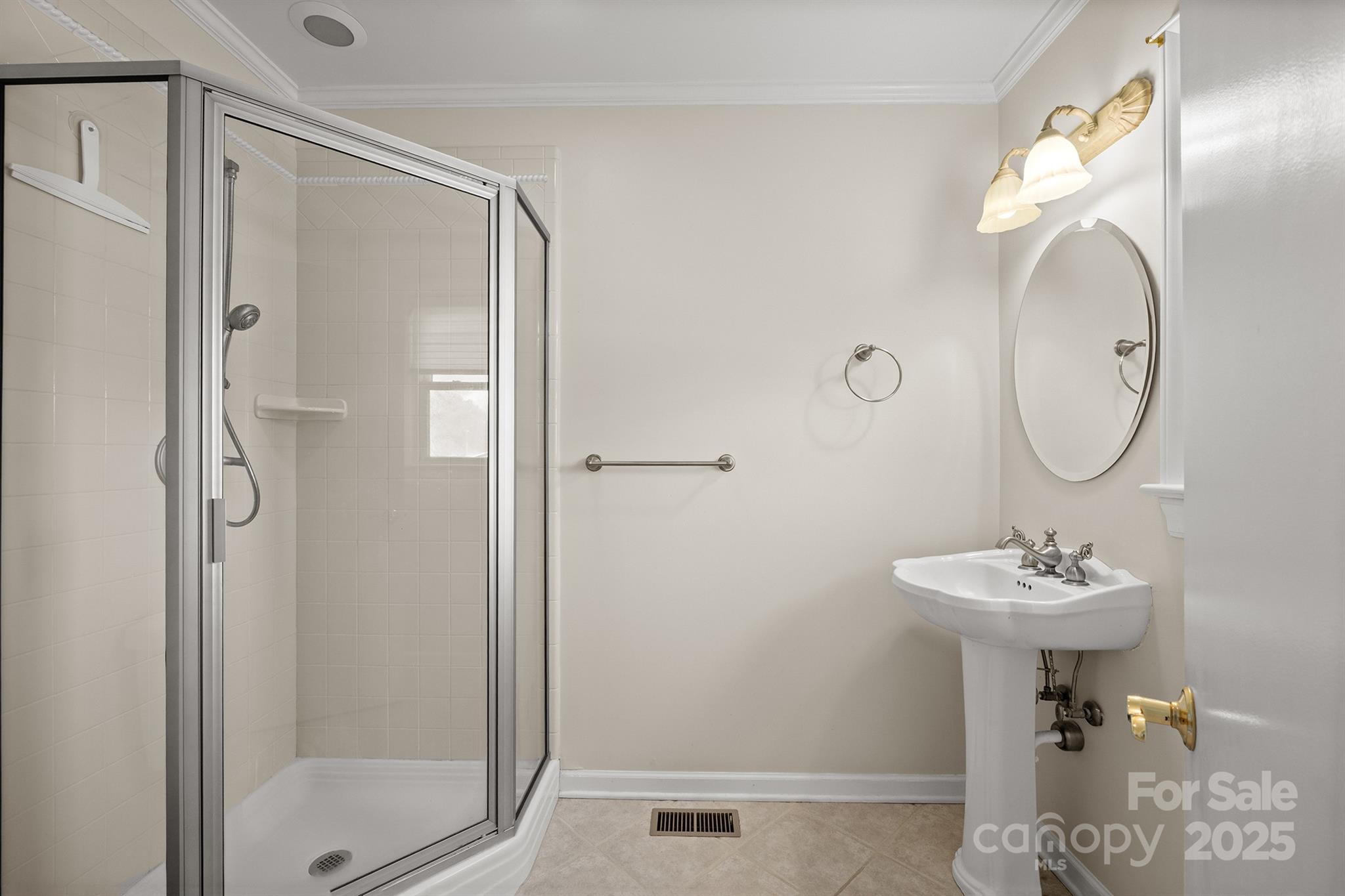 484 Stutts Road Mooresville, NC 28117 - Photo 21 of 28 a bathroom with a sink a mirror a vanity and a shower
